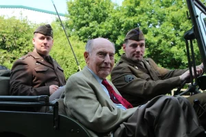 Si Spiegel sitting in a car